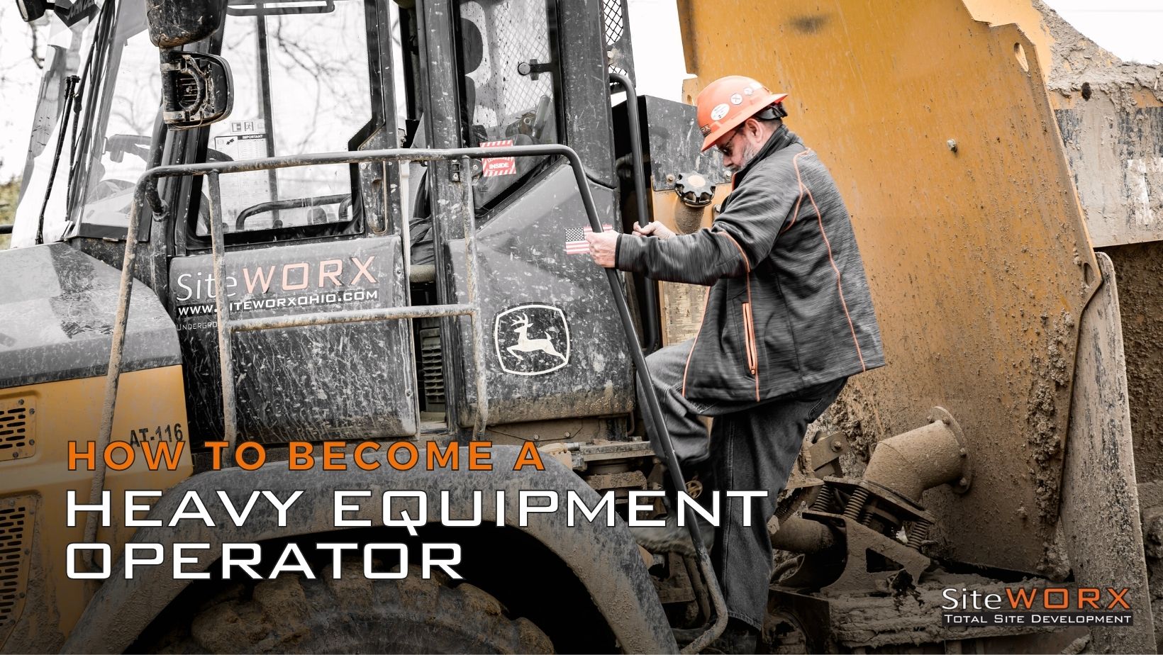 A man on getting on heavy equipment machine